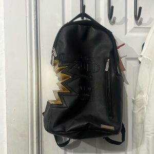 SPRAYGROUND A.I.3 SHARK BITE BLACK GOLD BACKPACK (USED)